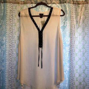 Plus size white sleeveless top with black vneck